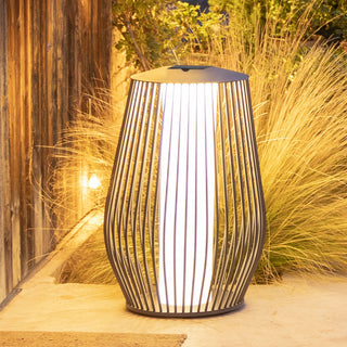 Mandalay solar floor lamp lighting up outdoor backyard