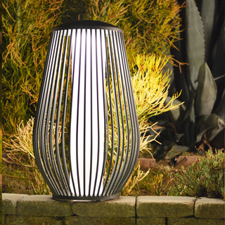 Mandalay solar floor lamp lighting up outdoor landscape