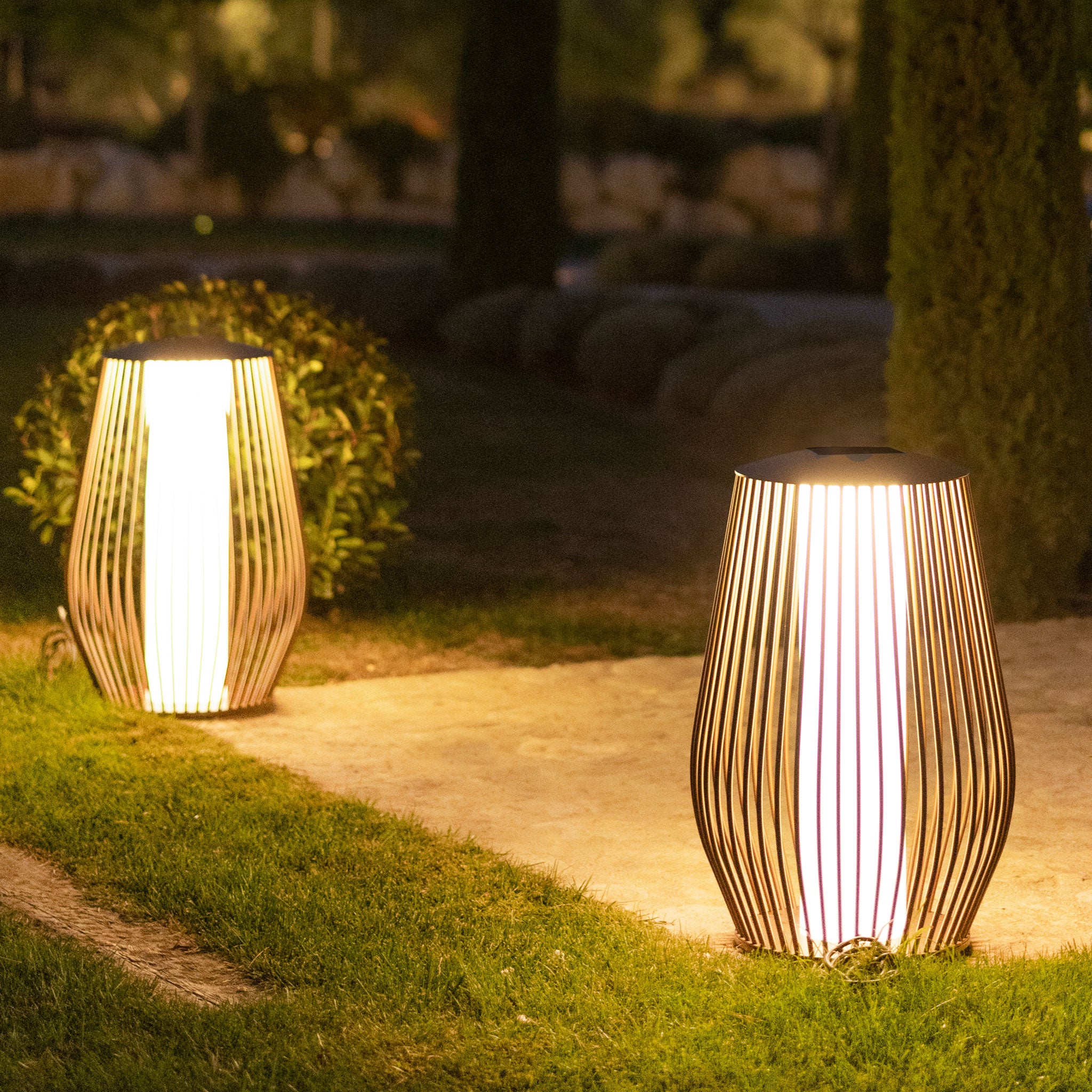 2 Mandalay solar floor lamp lighting up outdoor garden