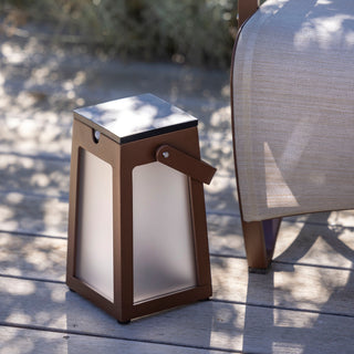 Tinka solar lantern corten finish on wood deck